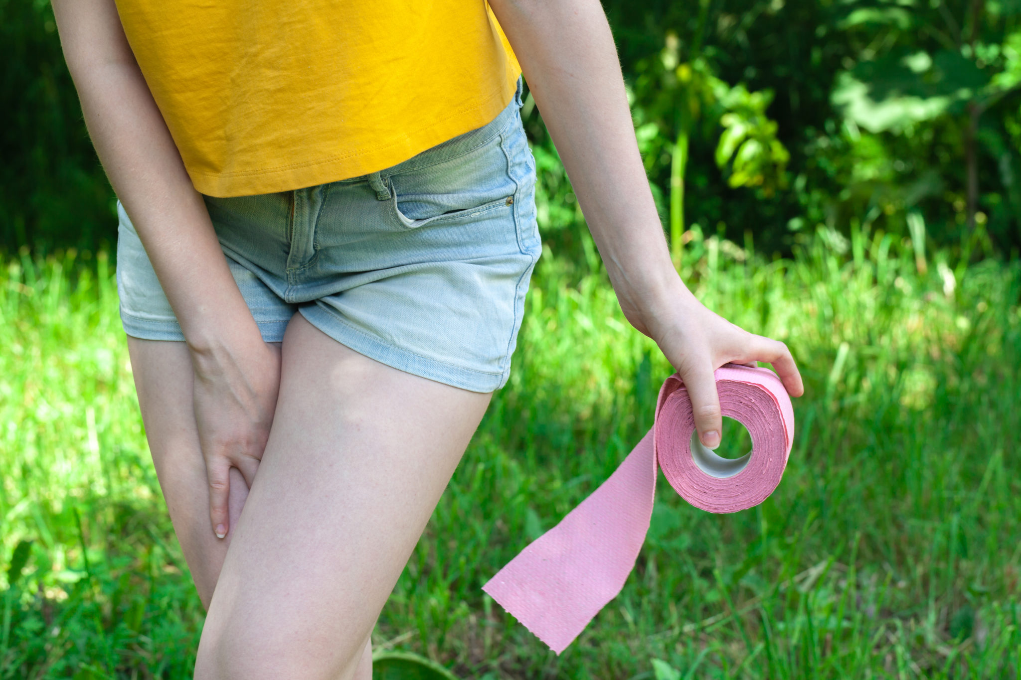 Female With Toilet Paper Outdoor, Cystitis Healthcare Problem